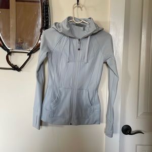 Athleta light gray zip up hoodie with pockets and finger gloves